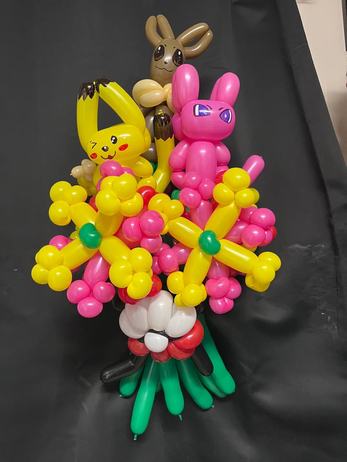 Spring balloon arrangement with bunnies, chicks and flowers